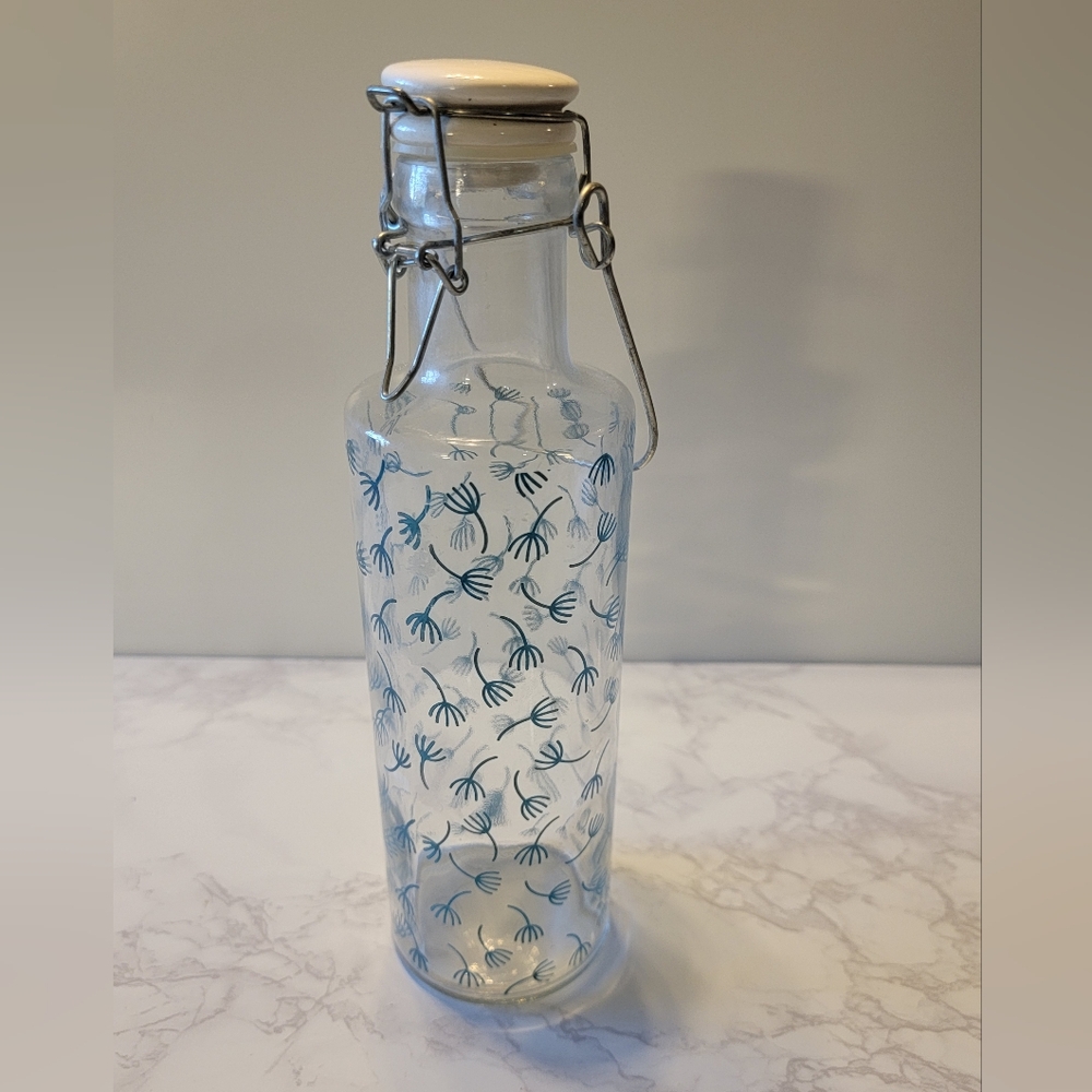 Glass Reusable water bottle with ceramic top with rubber gasket and blue print